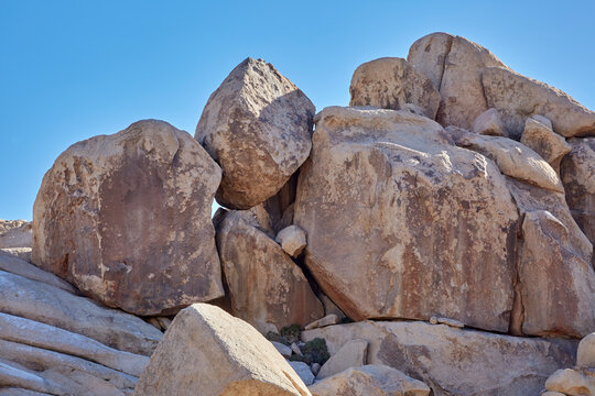 Giant rocks and boulders piled up looking like an artistic sculpture