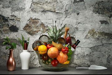 Bowl of fruit and bar tools on a stone background
