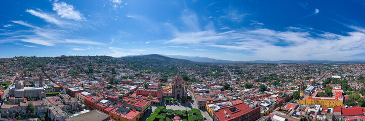 Fototapeta na wymiar Aerial: San Miguel de Allende beautiful downtown and landscape. Drone view 
