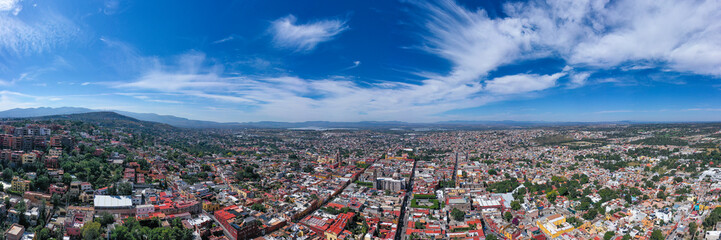 Aerial: scenic cityscape and landscape in San Miguel de Allende, Mexico. Drone view