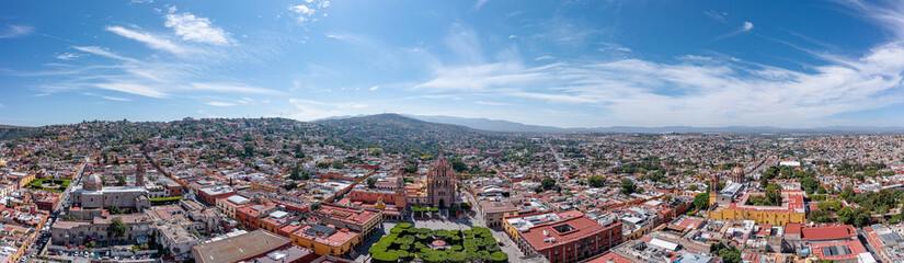 Fototapeta na wymiar Aerial: scenic cityscape and landscape in San Miguel de Allende. Drone view