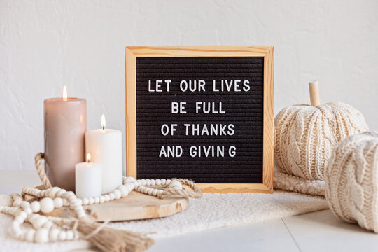 Felt Letter Board And Text Let Our Lives Be Full Of Thanks And Giving. Autumn Table Decoration. Interior Decor For Thanksgiving And Fall Holidays With Handmade Pumpkins And Candles