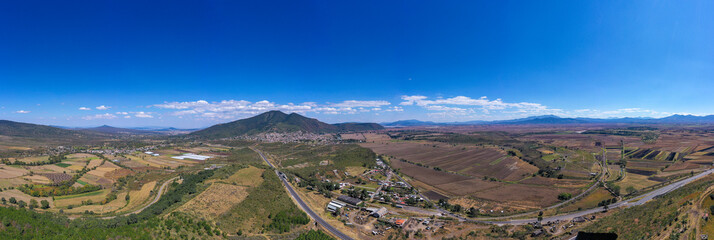 Aerial: panoramic view of the mountains in the village. Drone view