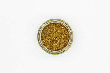 Spices Cumin Zira on a white background. Oriental seasoning for cooking rice and meat pilaf. Aromatic spicy spices for delicious dishes. Dried Whole seeds flowering plant of a fruit Cumin. Isolated