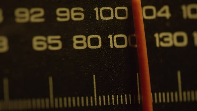 Tuning FM AM radio stations on receiver dial. Change the frequency. Vintage radio, antique, retro. Tuning Red Line. Close-up, Macro shot, Depth of field. Filmed in RAW 120fps 4K