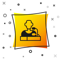 Black Football player press conference icon isolated on white background. Yellow square button. Vector