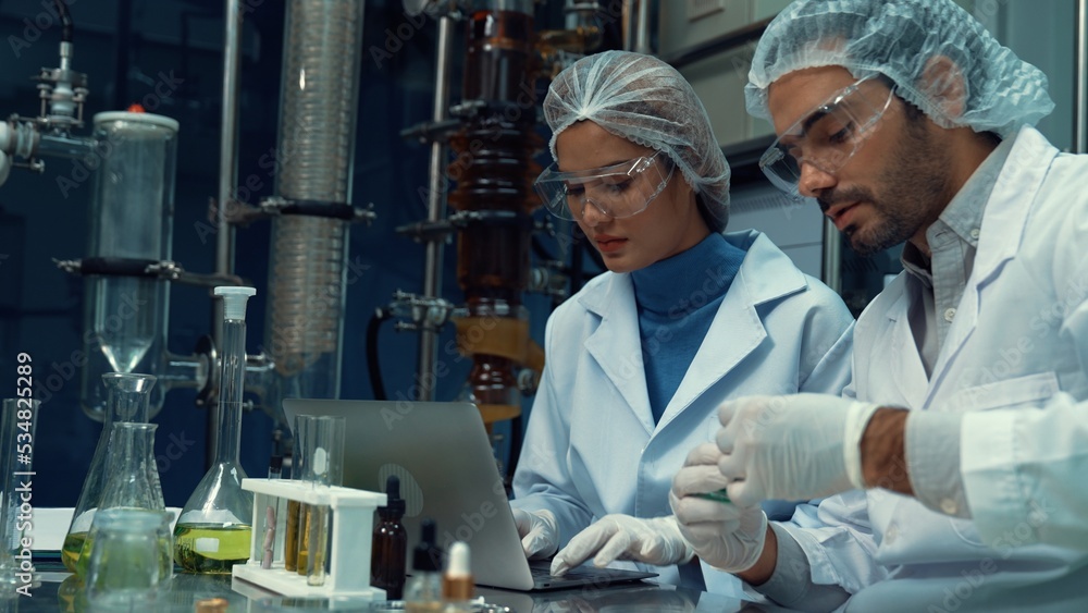 Poster two scientist in professional uniform working in laboratory for chemical and biomedical experiment