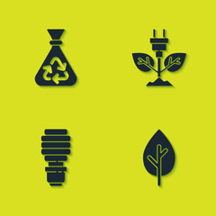 Set Garbage bag with recycle, Tree, LED light bulb and Electric saving plug in leaf icon. Vector