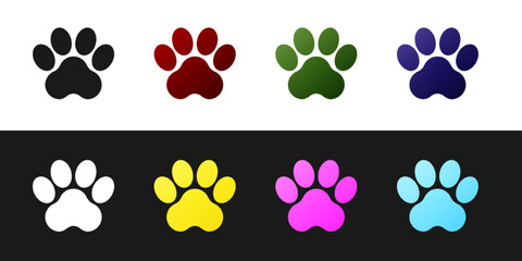Obraz na płótnie Canvas Set Paw print icon isolated on black and white background. Dog or cat paw print. Animal track. Vector