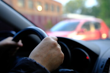 Hand of man driving inside car selective focus