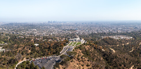 Aerial: Los Angeles beuatiful landscape and Griffith park hills. Drone View 
