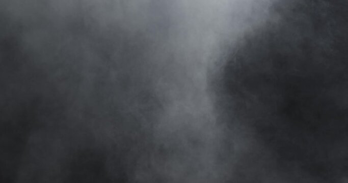 Fog haze on dark background. Realistic atmospheric gray smoke cloud. Filmed with RED camera in 4K.