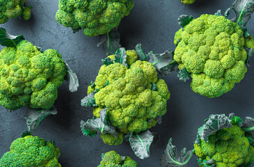 Broccoli on a graphite background. Healthy food. Top view, copy space