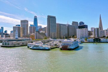 Aerial: San Francisco Bay Area panoramic cityscape and boats on the shore. Drone view 
