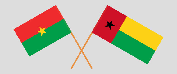 Crossed flags of Burkina Faso and Guinea-Bissau. Official colors. Correct proportion