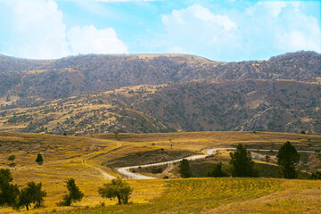 Fototapeta premium the road leading to the mountains, a beautiful landscape