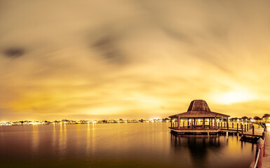 Amazing gazebo structure by the lagoon at night

