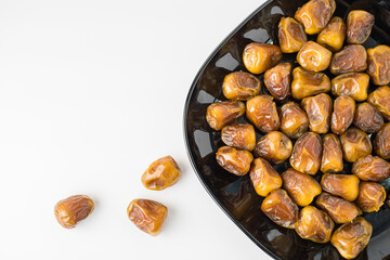 Delicious Sukari dates ( kurma sukari ) Much sought after during the month of Ramadan as a dish to break the fast, ramadhan kareem, in white background, empty space, copy space