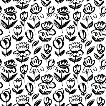 Seamless pattern with brush-drawn flowers. Hand drawn botanical ornament with floral motif in sketch style. Black chamomile or daisy painted by brush. Abstract blossoms on stems with leaves.