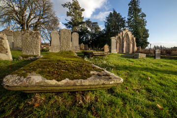 Fototapeta na wymiar Kincardine Graveyard. St Lolan's Church And Burial Ground. County Stirling. Scotland. U.K. Site of former parish church. Contains two burial enclosures, both with fine armorial panels of 1699