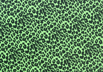 grungy green paper background with leopard spots prints