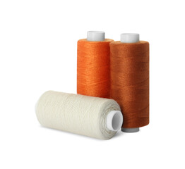 Different colorful sewing threads on white background