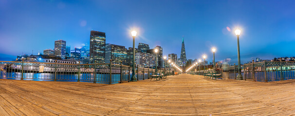 Scenic view of the pier and downtown of San Francisco, California at night 
