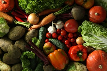 Different fresh ripe vegetables as background, top view. Farmer produce
