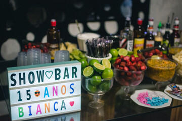 Bar table decorated with drinks and fruits