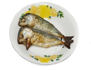 Two grilled mackerel in a white plate