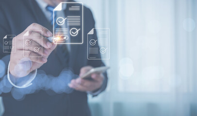 Businessman wearing suits use a pen to sign electronic signature digital documents of paperless with copy space. Paperless, digital document, electronic signature concept.