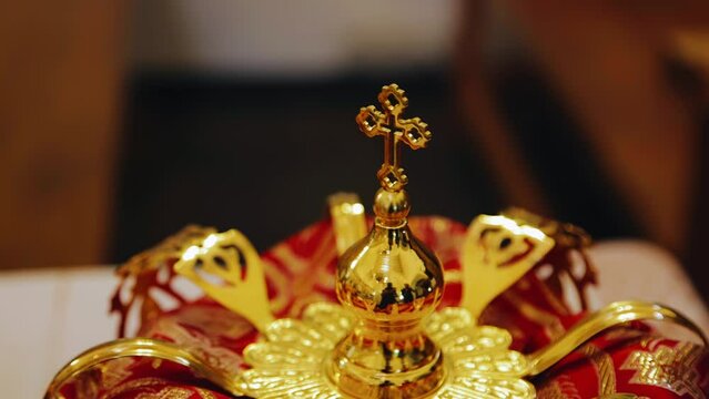 Close-up of the headdress of an Orthodox priest. There is a cross on top of the cap
