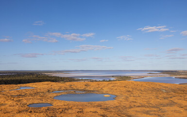 Fototapeta na wymiar Aerial view of Salt lakes and puddles on Baladjie Rock in the Wheatbelt region of Western Australia