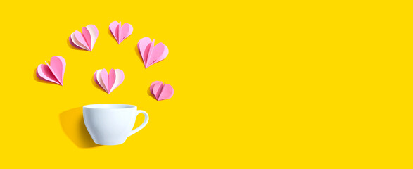 Coffee cup with paper craft hearts