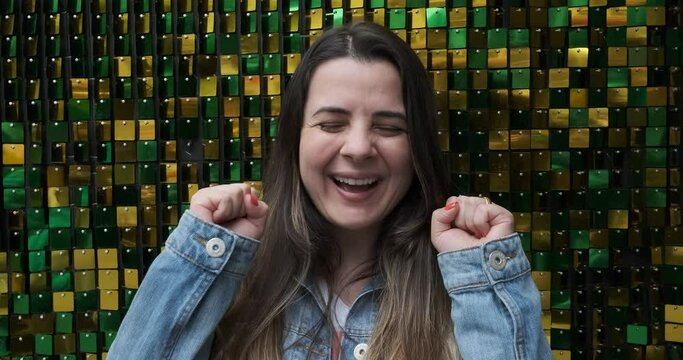 Woman celebrating the news she received on a brazil background
