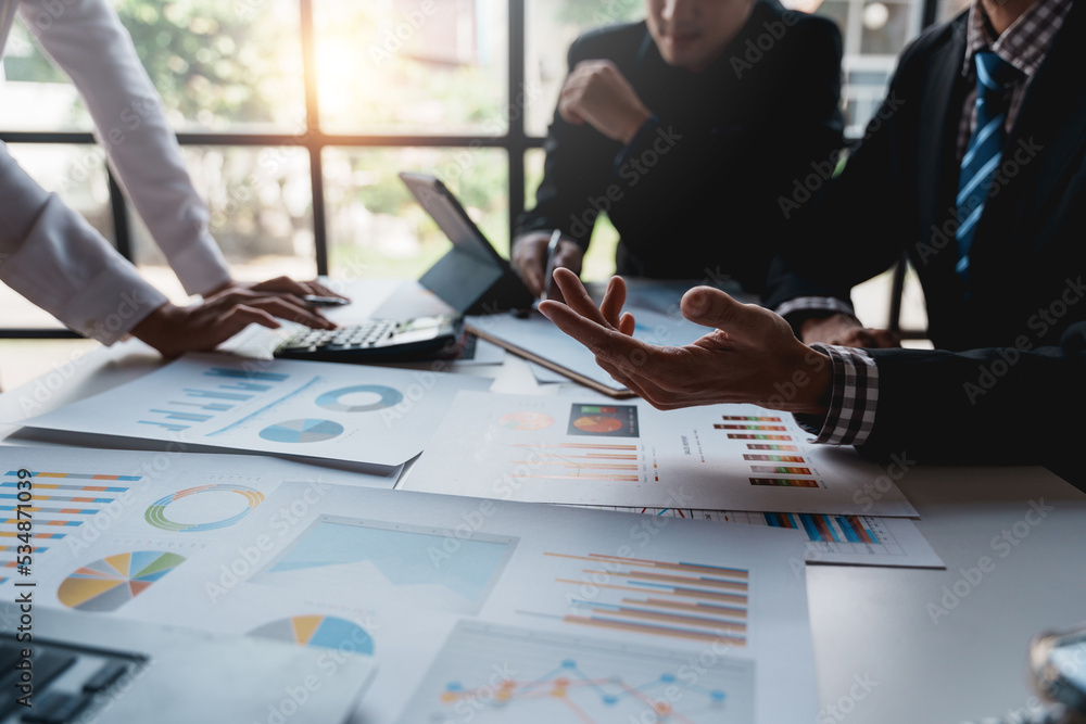 Poster businesspeople pointing to graphs and charts, thinking and analyzing various data in reports market 