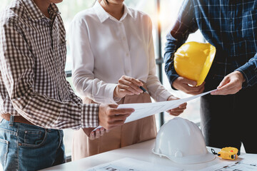 Architect or engineers are meeting to discuss home design. modify plans build a construction...