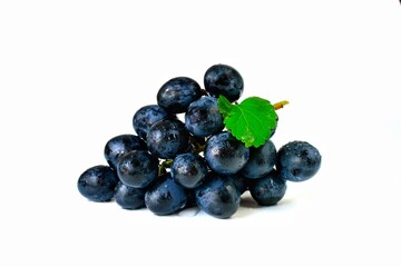 Black grapes candied fruit on a white background
