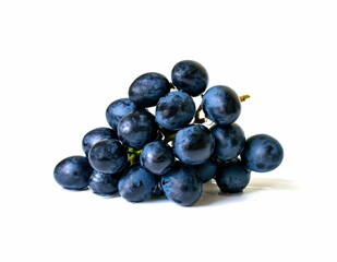 Black grapes candied fruit on a white background