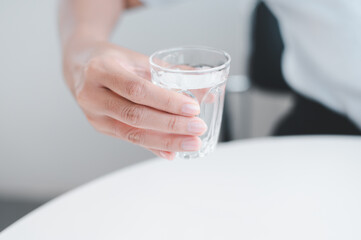 glass of water in hand