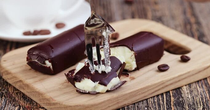 Curd dessert cheese made of milk with milk chocolate, sweet dessert made of dairy products and chocolate