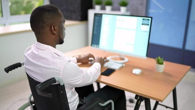Happy Man With Disability Using Computer