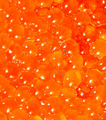 Red caviar as an abstract background.