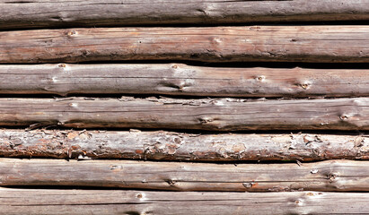 Wooden logs on the wall from the log house.
