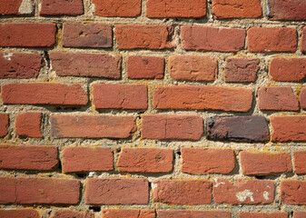 Old red bricks on the wall.