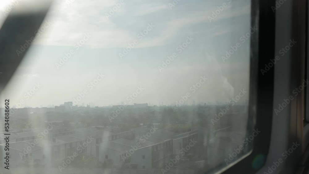 Canvas Prints outside view while riding airpiort rail link skytrain with local landscape view of bangkok in sunset