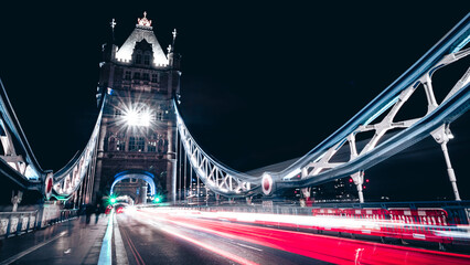 Fototapeta na wymiar The Tower Bridge by night. Blurred car lights. 