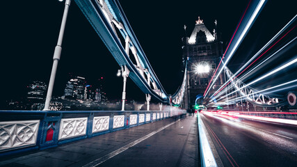 The Tower Bridge by night. Blurred car lights.