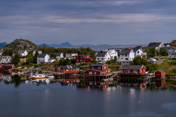 Fototapeta na wymiar mountain village in the mountains, Lofoten islands, reflections in the water