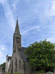 Historic church spire Ergue Gaberic Brittany France with blue sky